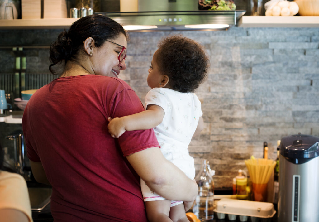 Mother and baby daughter in the kitchen